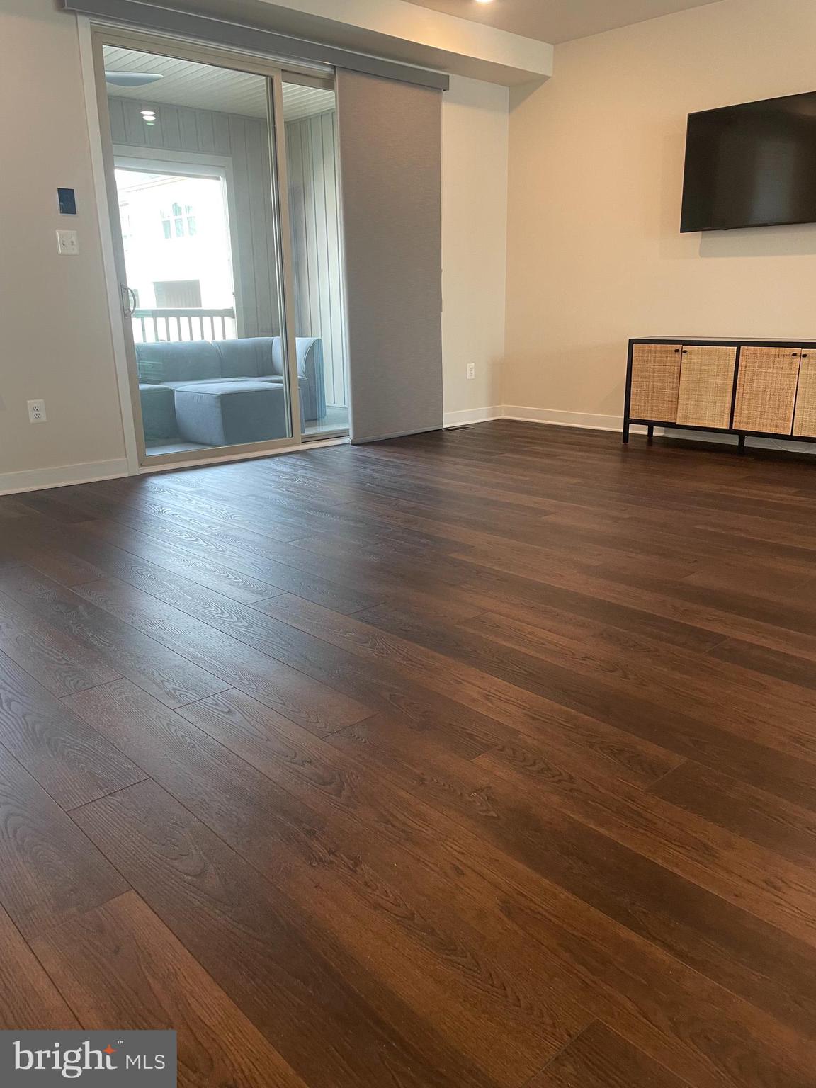 4607 Plum Road Monrovia, MD 21770 - Photo 11 of 52 an empty room with wooden floor and windows