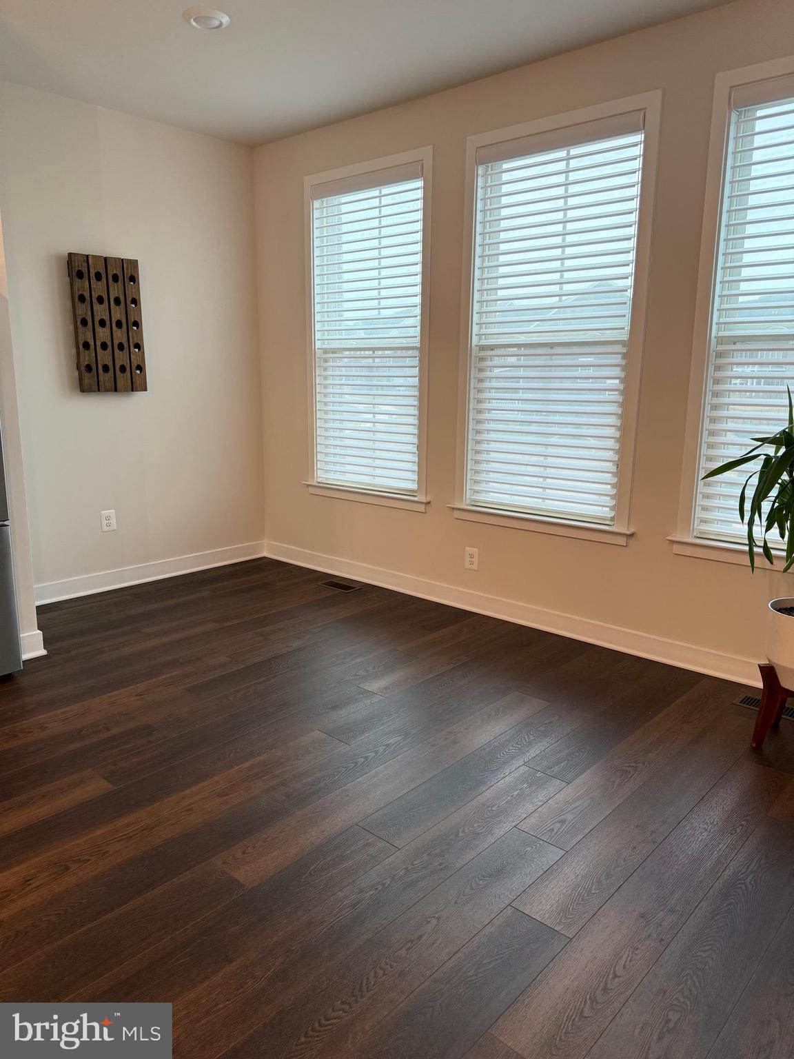 4607 Plum Road Monrovia, MD 21770 - Photo 13 of 52 a view of an empty room with wooden floor and a window
