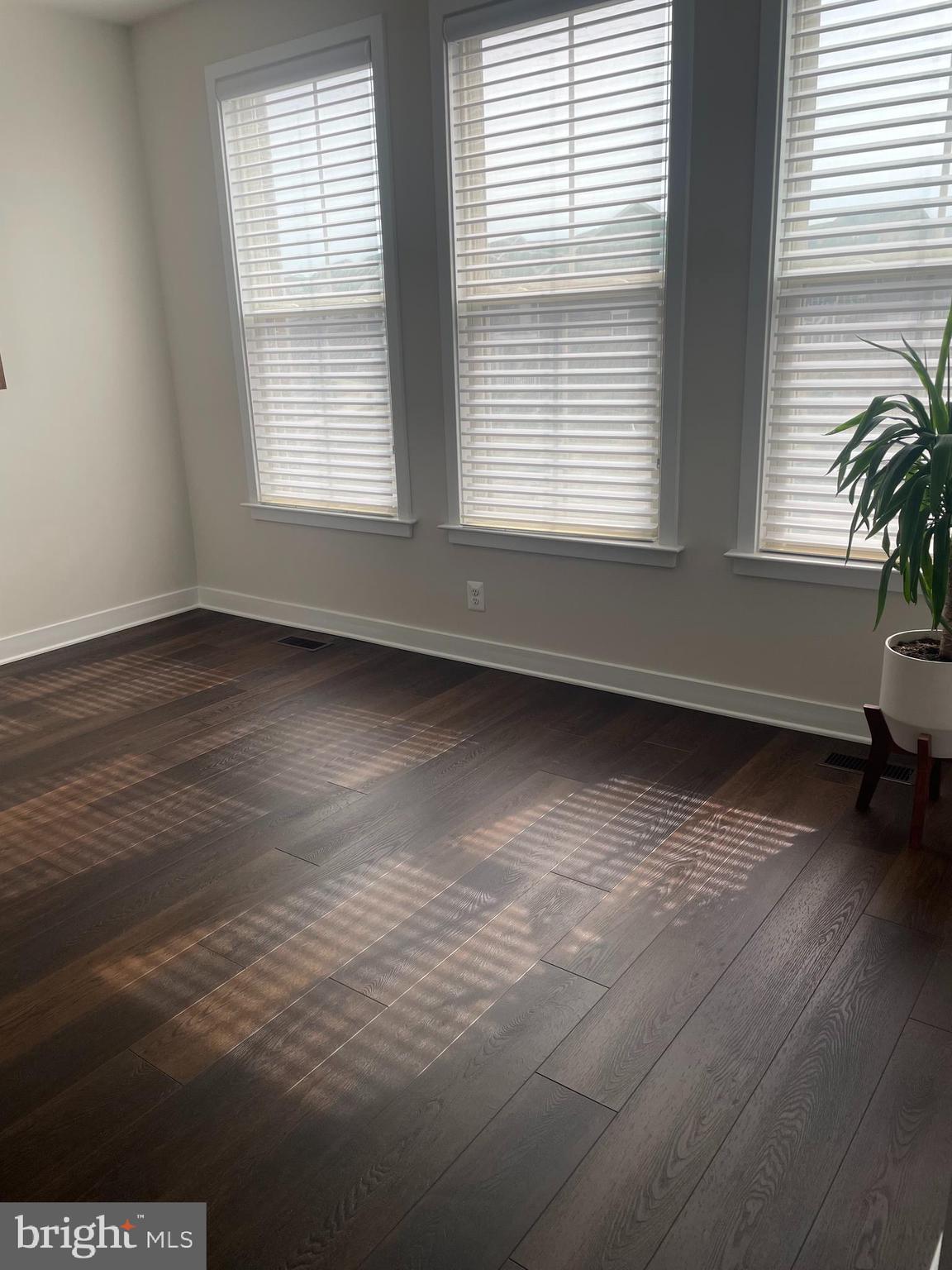 4607 Plum Road Monrovia, MD 21770 - Photo 14 of 52 a view of an empty room with wooden floor and a window