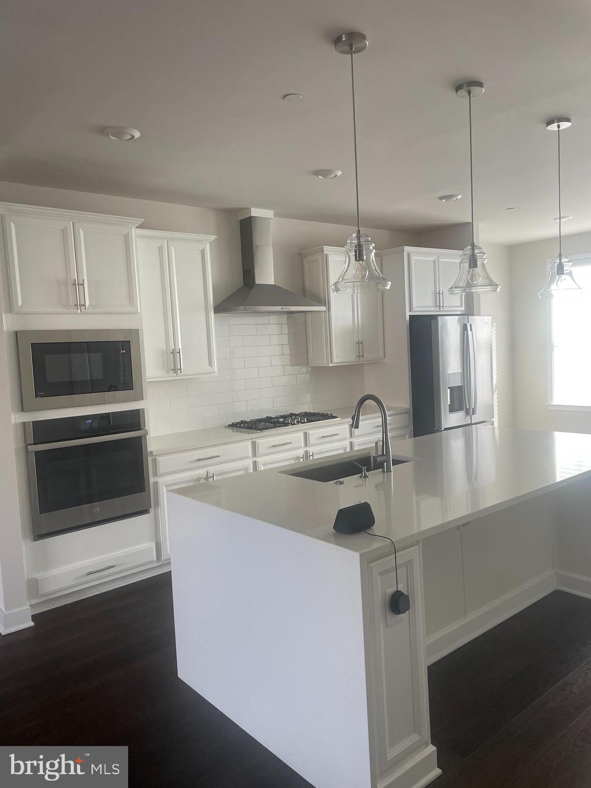 4607 Plum Road Monrovia, MD 21770 - Photo 3 of 52 a kitchen with stainless steel appliances granite countertop a sink a stove and a refrigerator