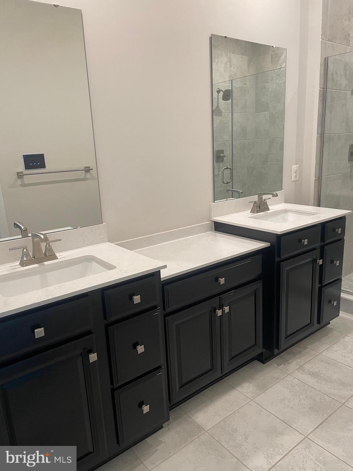 4607 Plum Road Monrovia, MD 21770 - Photo 33 of 52 a bathroom with a double vanity sink and mirror
