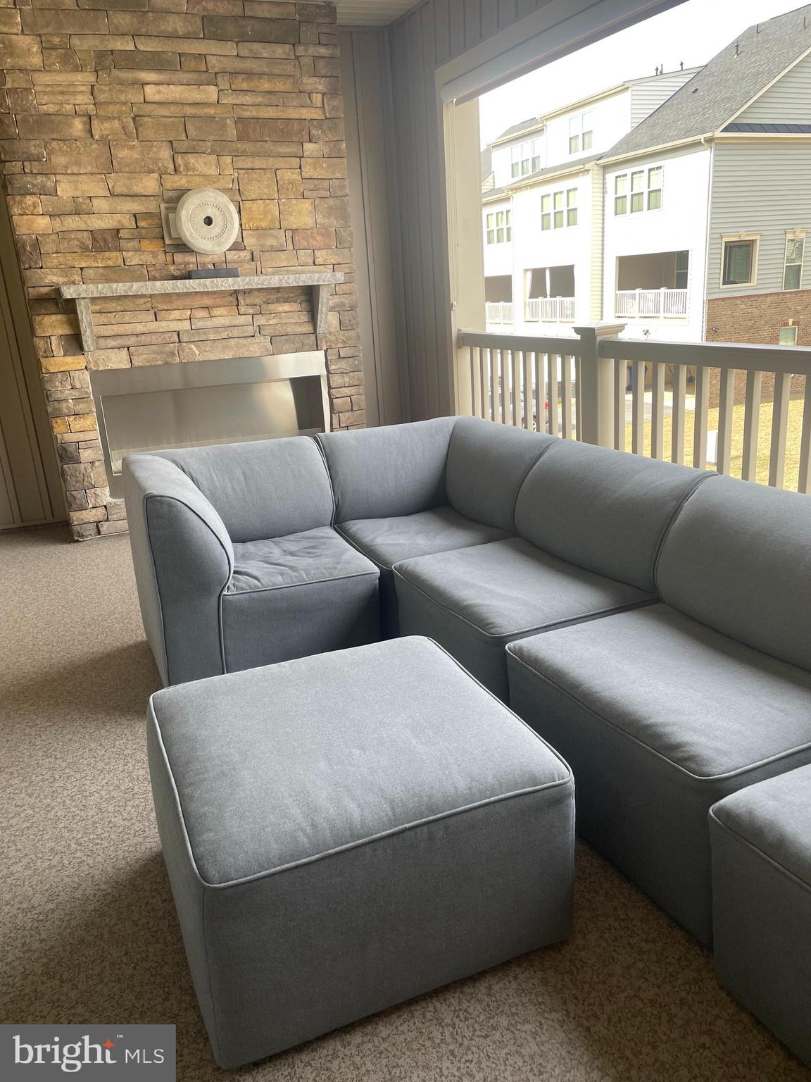 4607 Plum Road Monrovia, MD 21770 - Photo 39 of 52 a living room with furniture and a floor to ceiling window