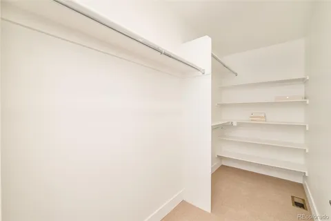 a view of an empty walk in closet