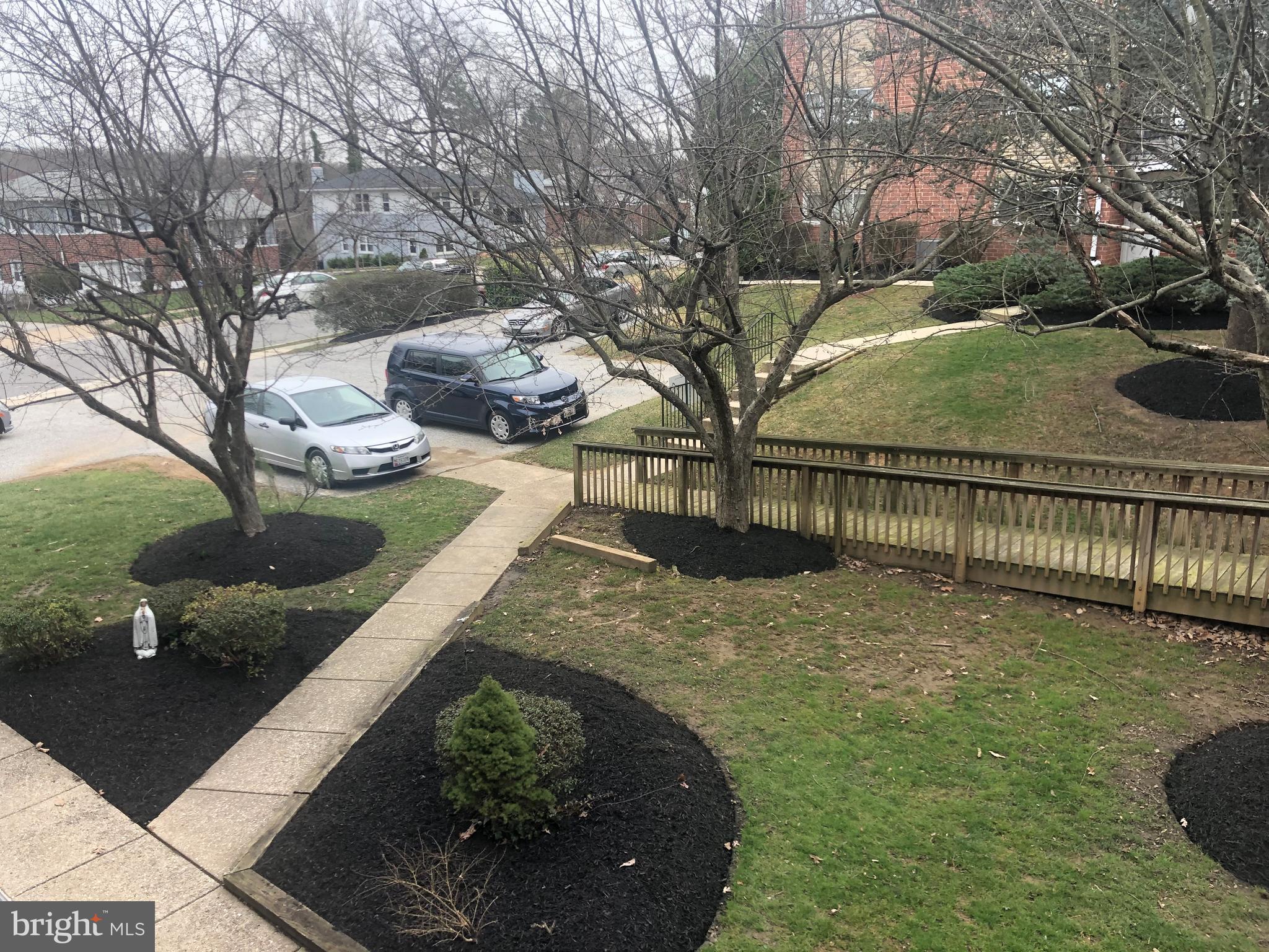 519 Epsom Road, Unit 1C Baltimore, MD 21286 - Photo 2 of 54 a view of a garden with wooden fence