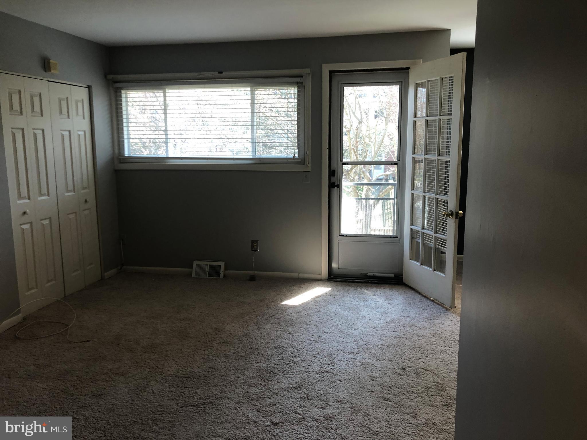 519 Epsom Road, Unit 1C Baltimore, MD 21286 - Photo 16 of 54 an empty room with a window