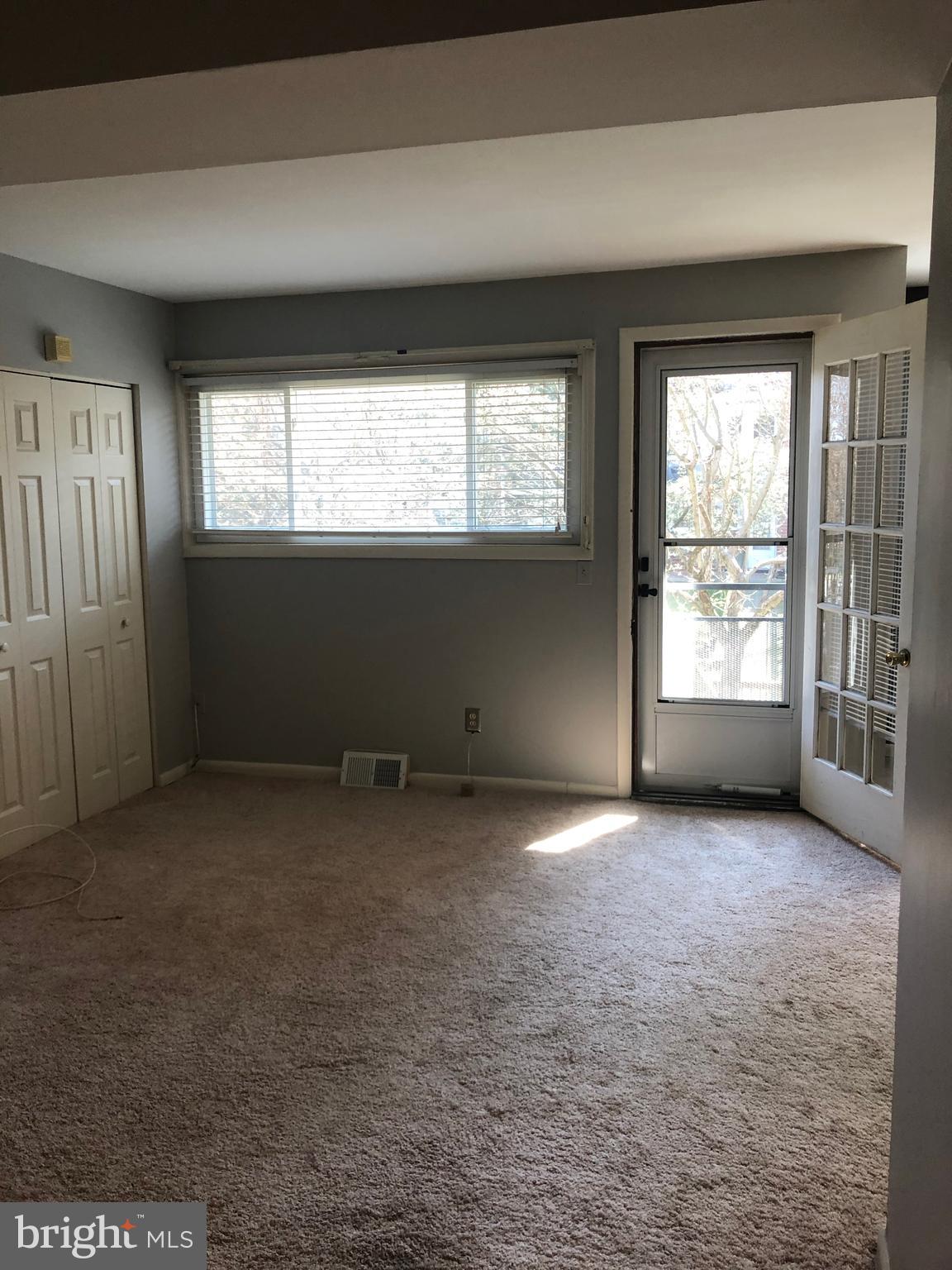 519 Epsom Road, Unit 1C Baltimore, MD 21286 - Photo 17 of 54 an empty room with windows