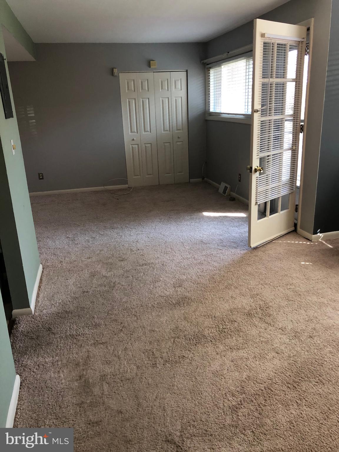 519 Epsom Road, Unit 1C Baltimore, MD 21286 - Photo 18 of 54 an empty room with windows