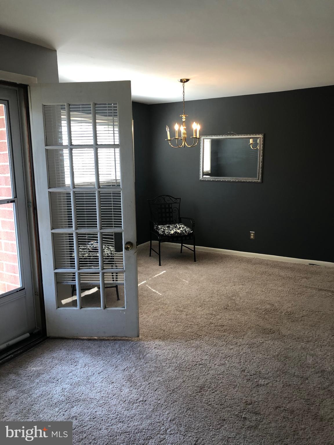 519 Epsom Road, Unit 1C Baltimore, MD 21286 - Photo 19 of 54 a view of an empty room with a window