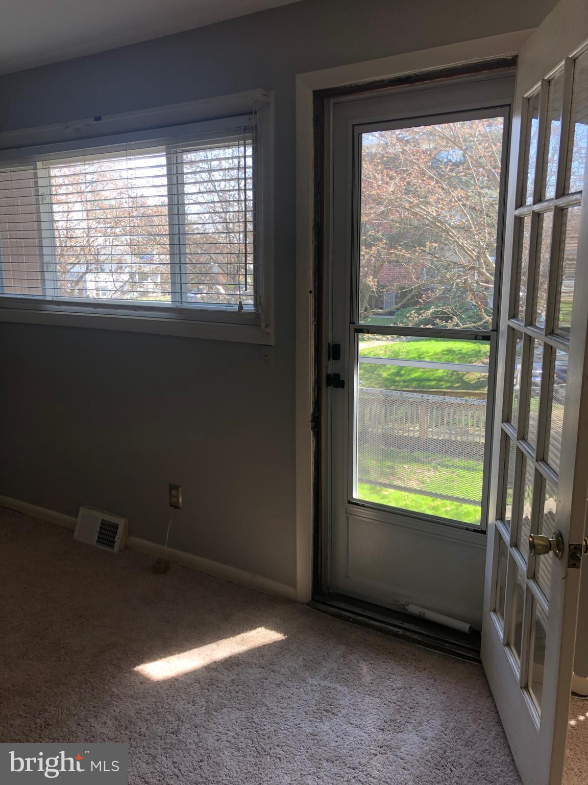 519 Epsom Road, Unit 1C Baltimore, MD 21286 - Photo 26 of 54 a view of an empty room with a window