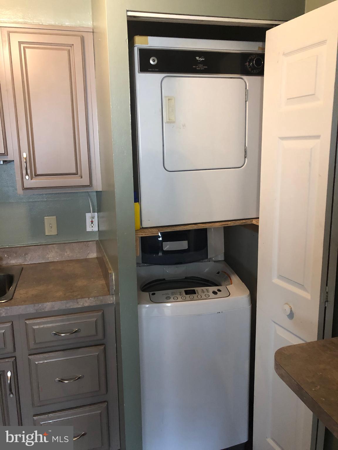 519 Epsom Road, Unit 1C Baltimore, MD 21286 - Photo 33 of 54 a utility room with dryer and washer