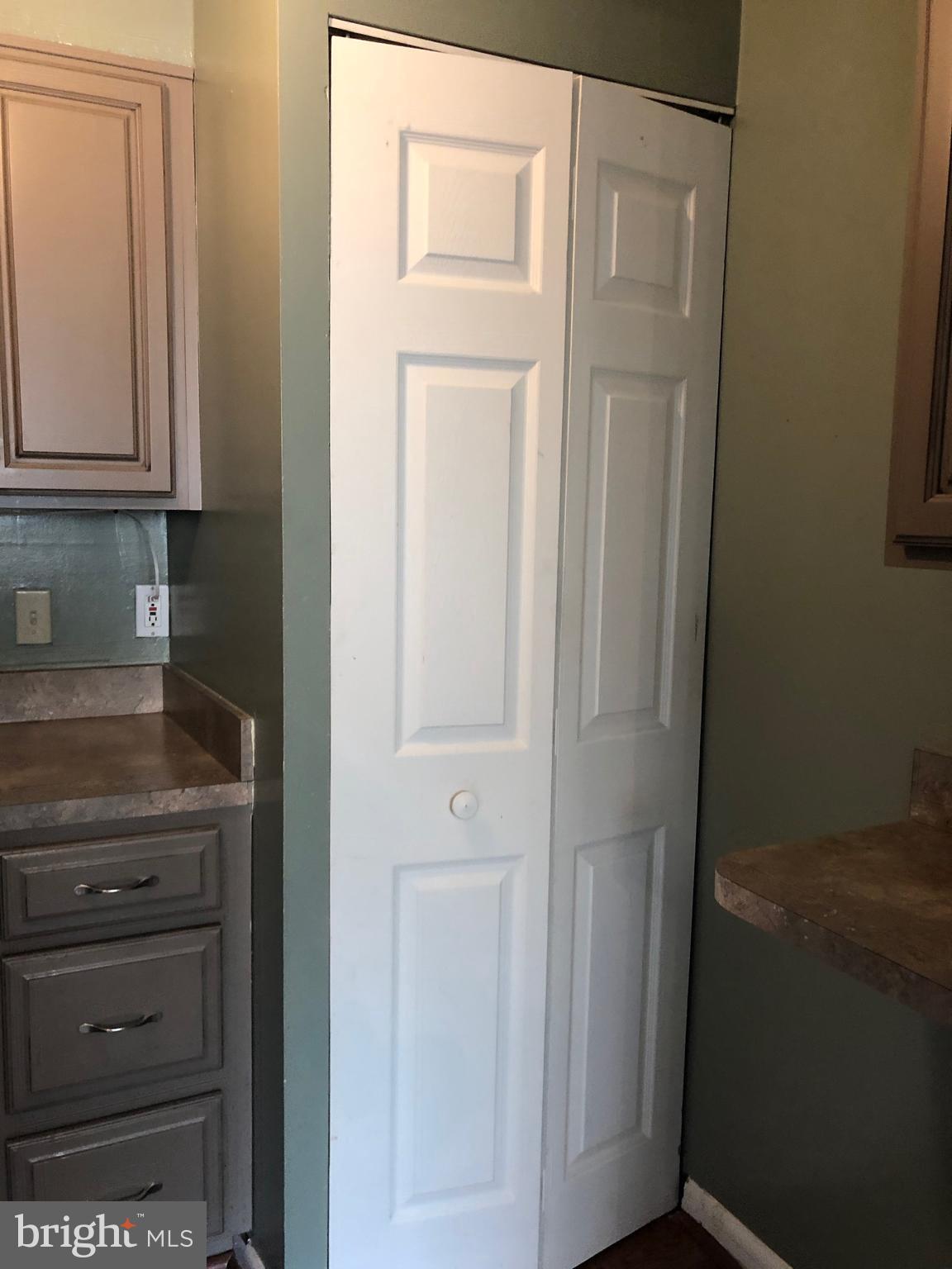 519 Epsom Road, Unit 1C Baltimore, MD 21286 - Photo 34 of 54 a bathroom with a granite countertop sink and a refrigerator