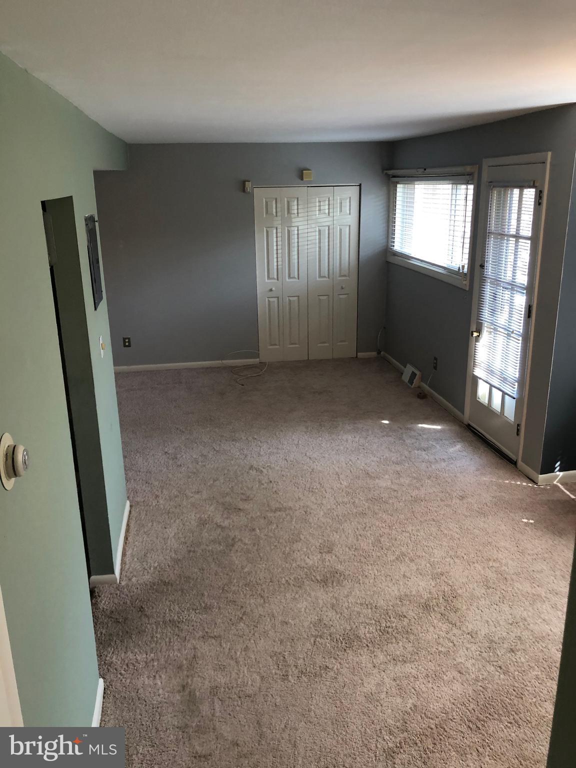 519 Epsom Road, Unit 1C Baltimore, MD 21286 - Photo 35 of 54 an empty room with windows
