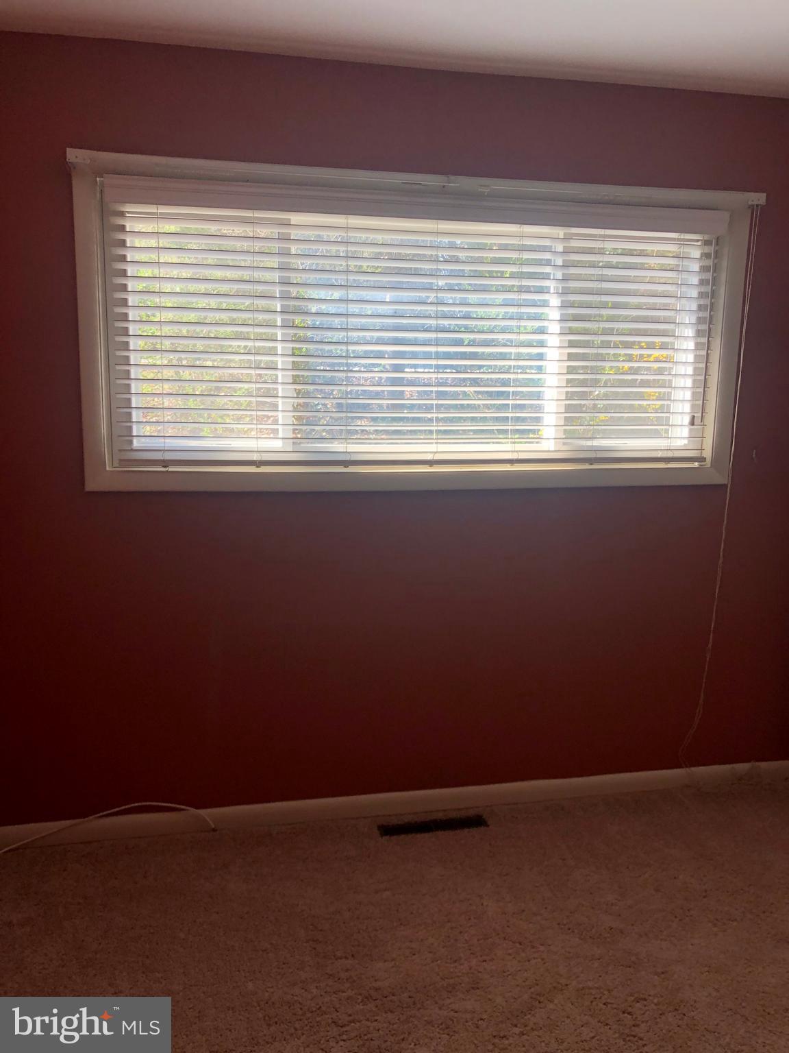 519 Epsom Road, Unit 1C Baltimore, MD 21286 - Photo 37 of 54 a view of an empty room with a window