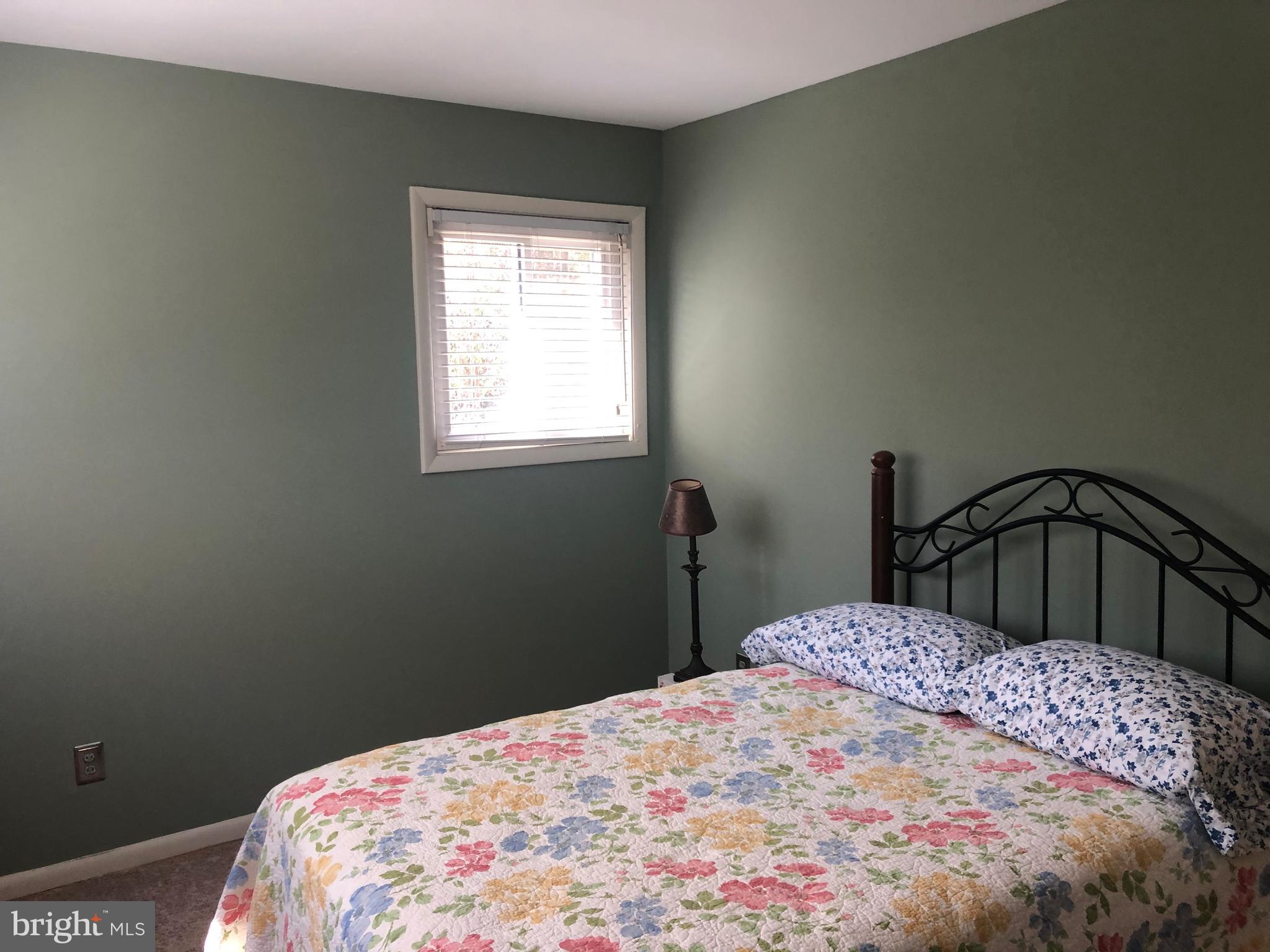 519 Epsom Road, Unit 1C Baltimore, MD 21286 - Photo 40 of 54 a bedroom with a bed and a window
