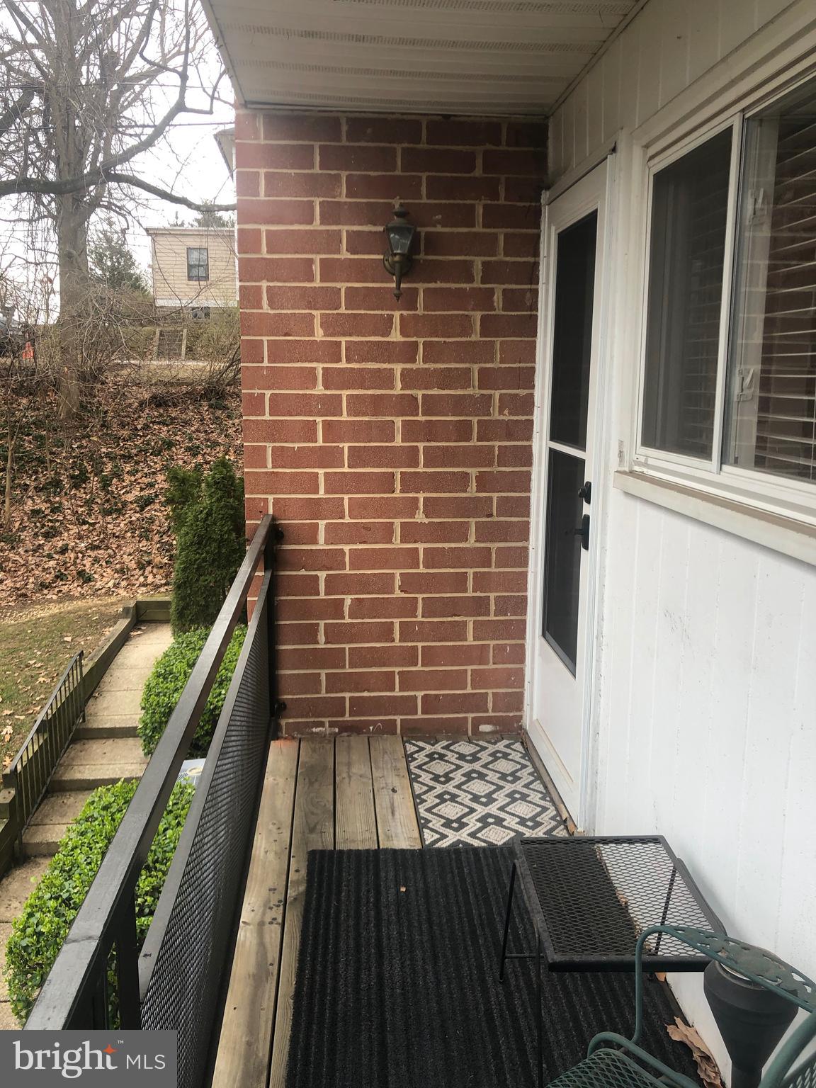 519 Epsom Road, Unit 1C Baltimore, MD 21286 - Photo 6 of 54 a view of a balcony with wooden floor