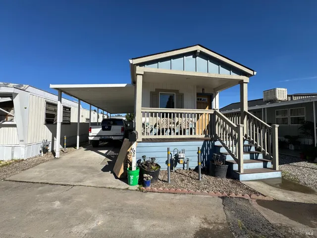 a front view of a house with parking area