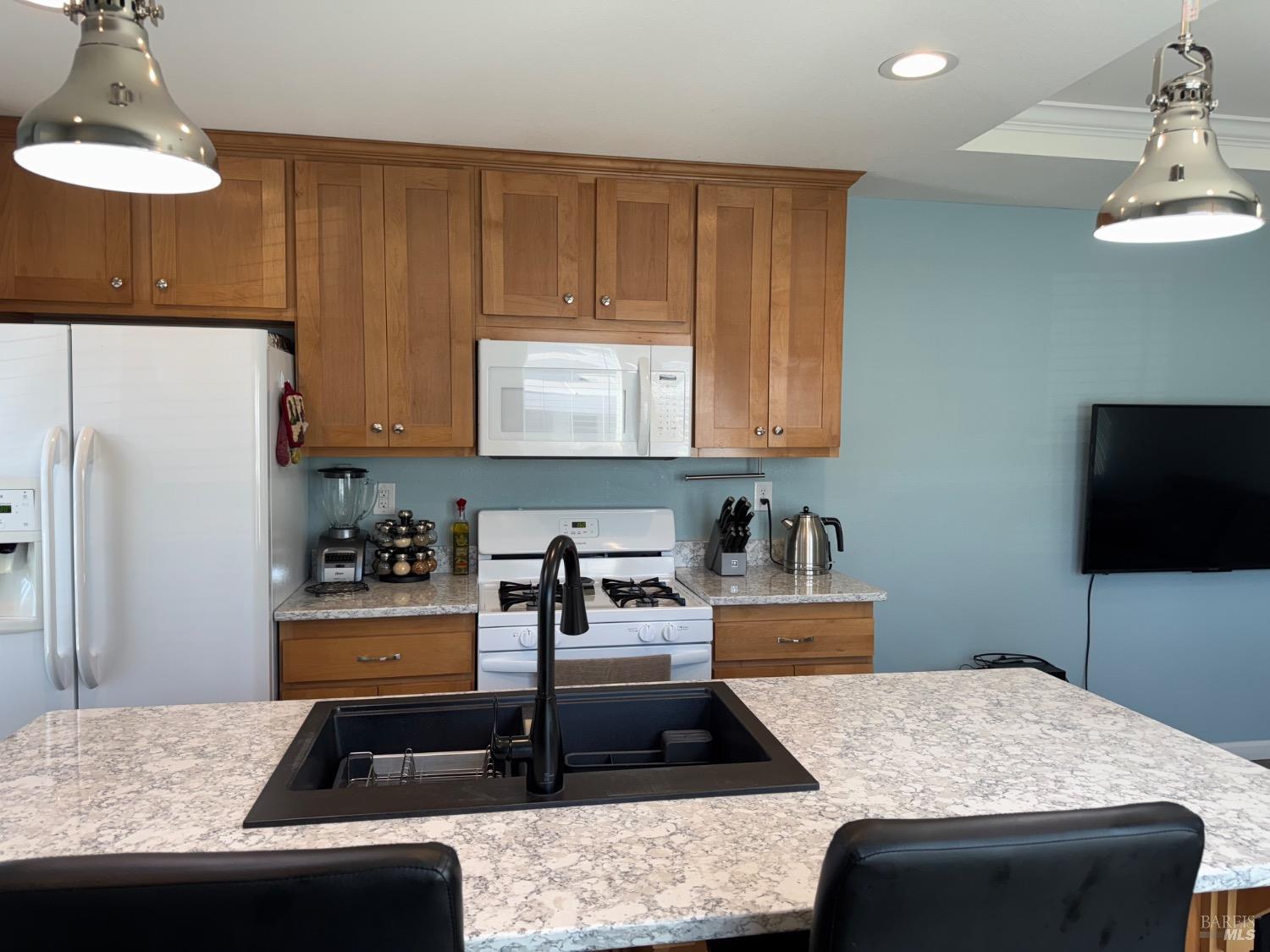 62 Romani Court Santa Rosa, CA 95407 - Photo 14 of 32 a kitchen with granite countertop a stove a sink and a refrigerator