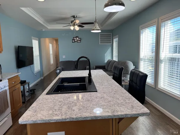 a kitchen with a table chairs and a refrigerator