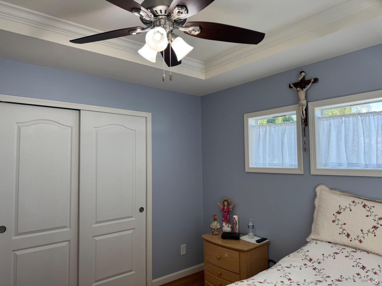 62 Romani Court Santa Rosa, CA 95407 - Photo 23 of 32 a bedroom with a bed and a chandelier fan