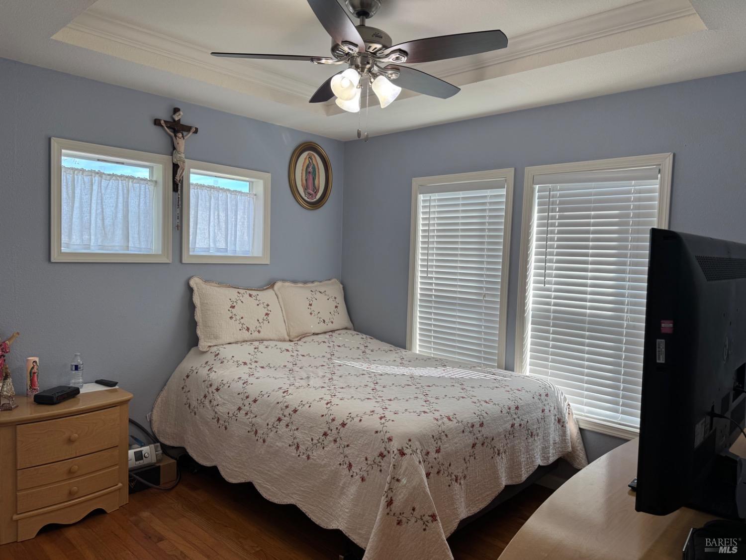 62 Romani Court Santa Rosa, CA 95407 - Photo 25 of 32 a bedroom with a bed and a flat screen tv