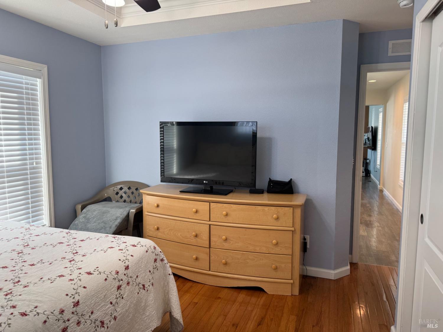 62 Romani Court Santa Rosa, CA 95407 - Photo 26 of 32 a bedroom with a bed and a flat screen tv in it