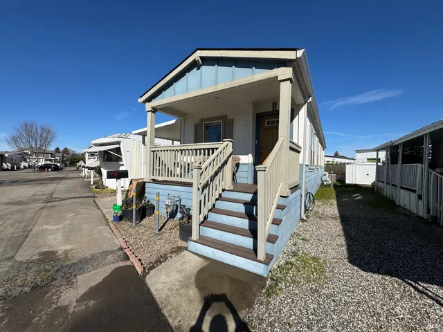 a view of a house with wooden stairs