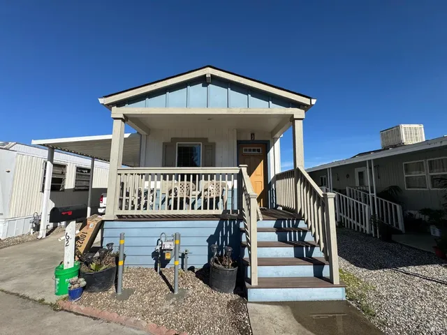 front view of a house with a small yard