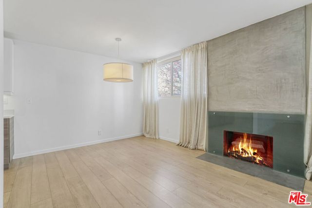 a view of an empty room and fire place
