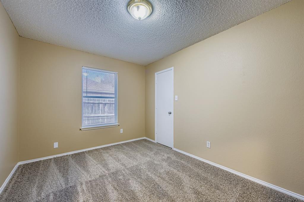 3326 Spring Meadow Lane Grand Prairie, TX 75052 - Photo 15 of 22 an empty room with windows