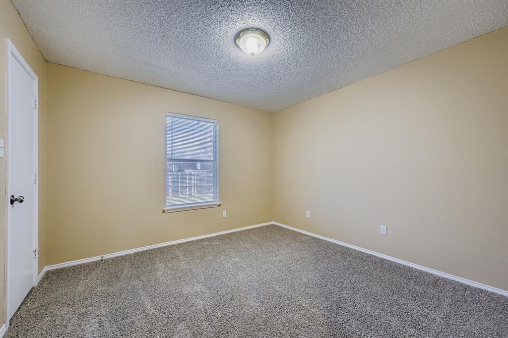 3326 Spring Meadow Lane Grand Prairie, TX 75052 - Photo 16 of 22 an empty room with a window