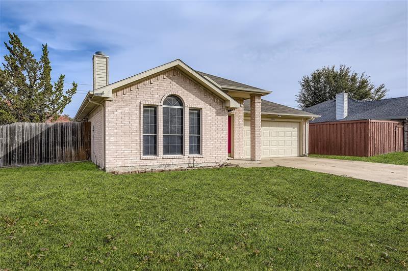 3326 Spring Meadow Lane Grand Prairie, TX 75052 - Photo 2 of 22 a view of a house with a yard