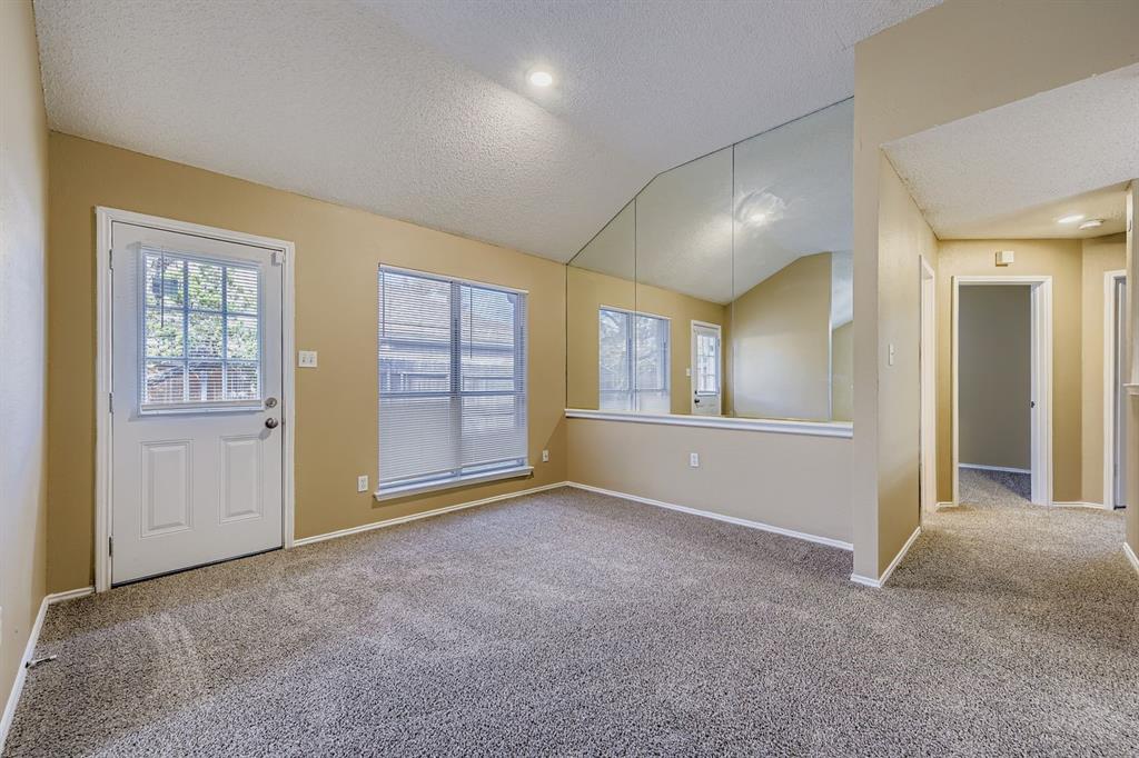 3326 Spring Meadow Lane Grand Prairie, TX 75052 - Photo 5 of 22 an empty room with windows and closet