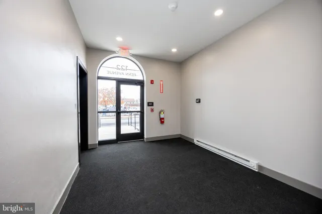 a bathroom with a double vanity sink toilet and mirror