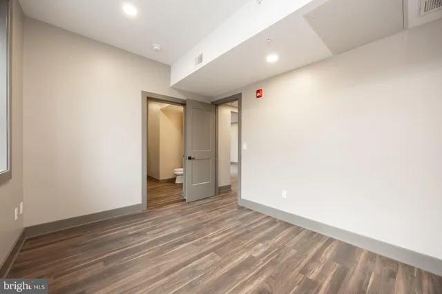 a kitchen with granite countertop a sink and a stove top oven