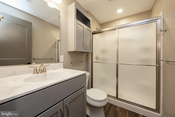 a kitchen with granite countertop a sink and cabinets