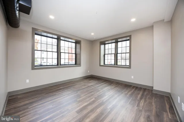 a kitchen with granite countertop a sink and steel appliances