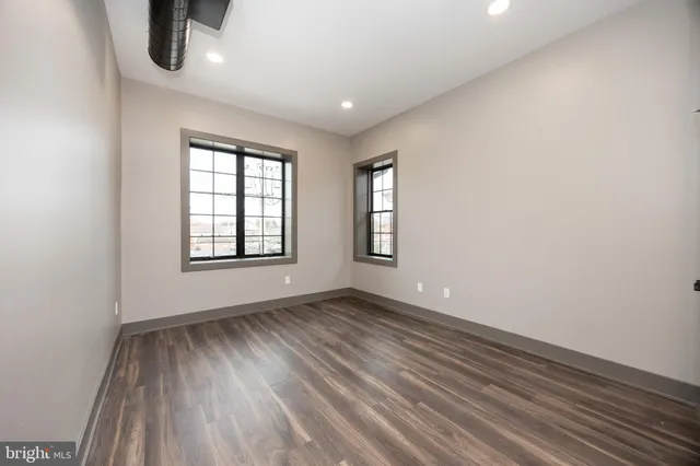 a kitchen with a refrigerator a sink and cabinets