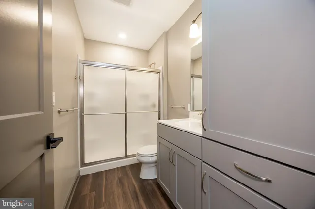 a kitchen with granite countertop a sink and a stove top oven