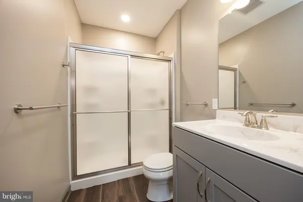 a kitchen with stainless steel appliances a refrigerator and a stove top oven