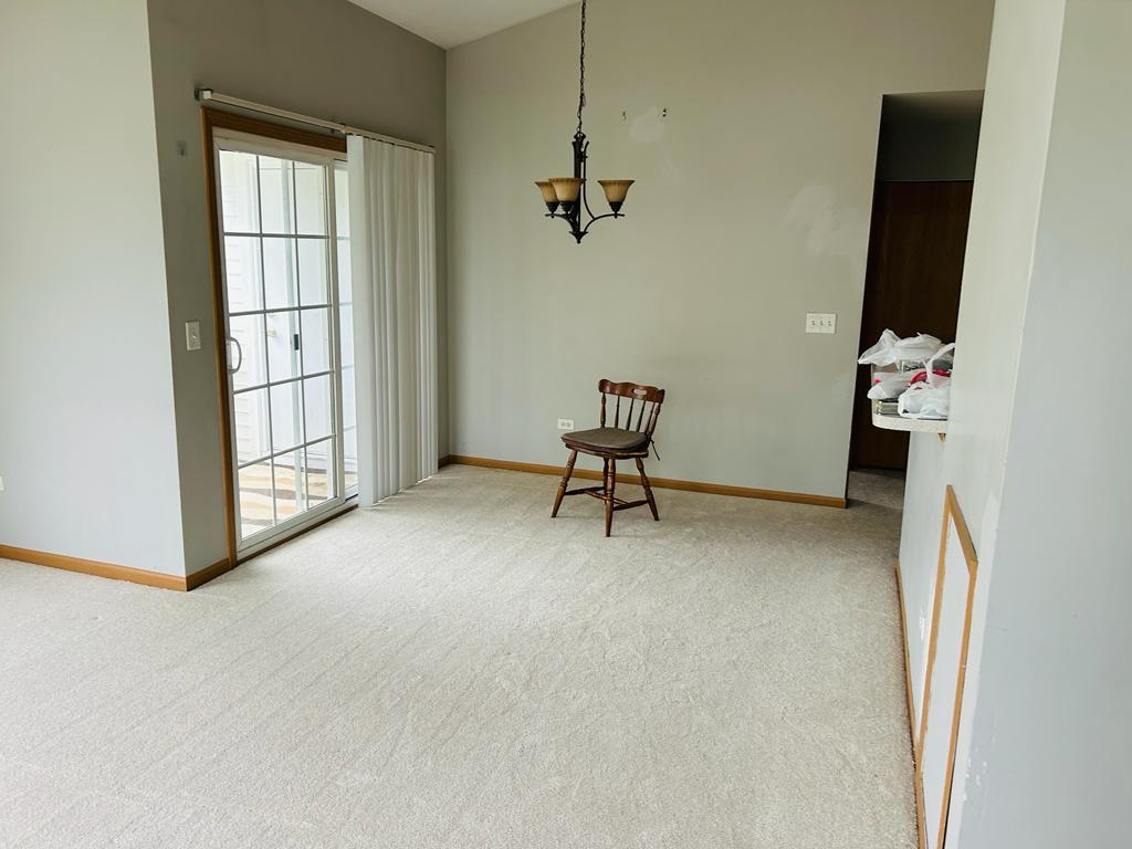 1131 Silverstone Drive, Unit 1131 Carpentersville, IL 60110 - Photo 23 of 23 an empty room with windows and closet