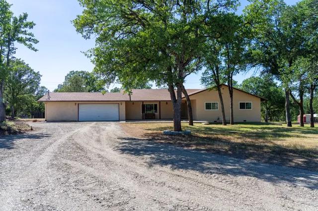 a house view with a backyard space