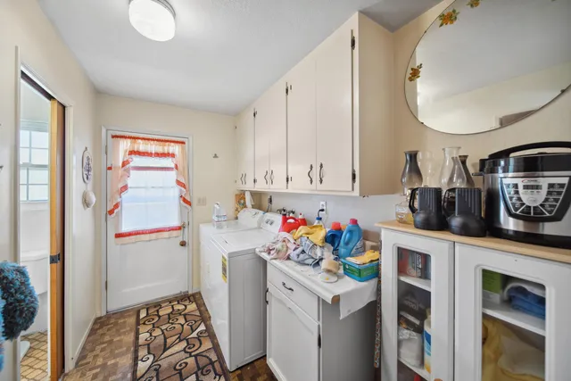 a storage room with wooden floor and cabinets