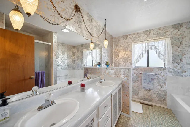 a bathroom with a sink a toilet and bathtub