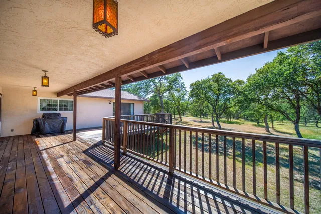 a view of deck with wooden floor and outdoor seating