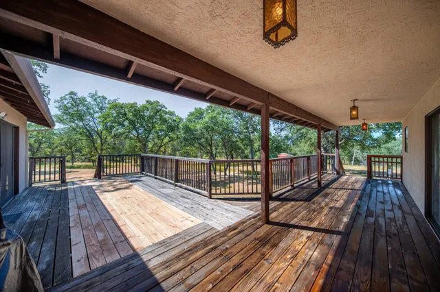a view of balcony with wooden floor and outdoor space