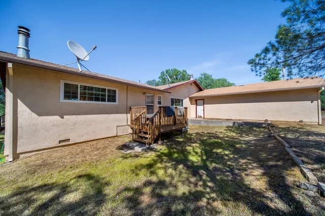 a house view with a backyard space