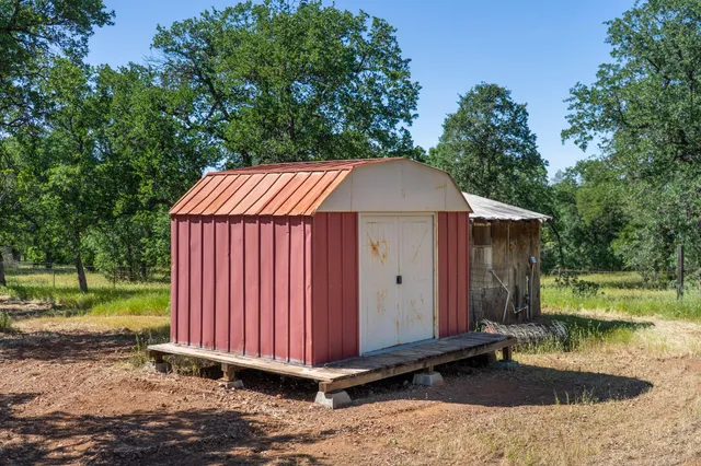 a house with trees in the background