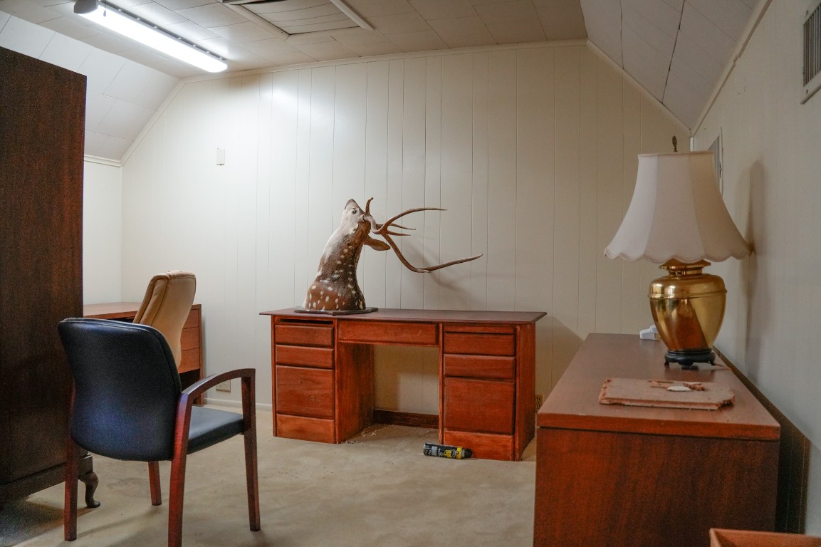 1400 Fm 609 Road Muldoon, TX 78949 - Photo 14 of 24 a room with a chair and a chandelier