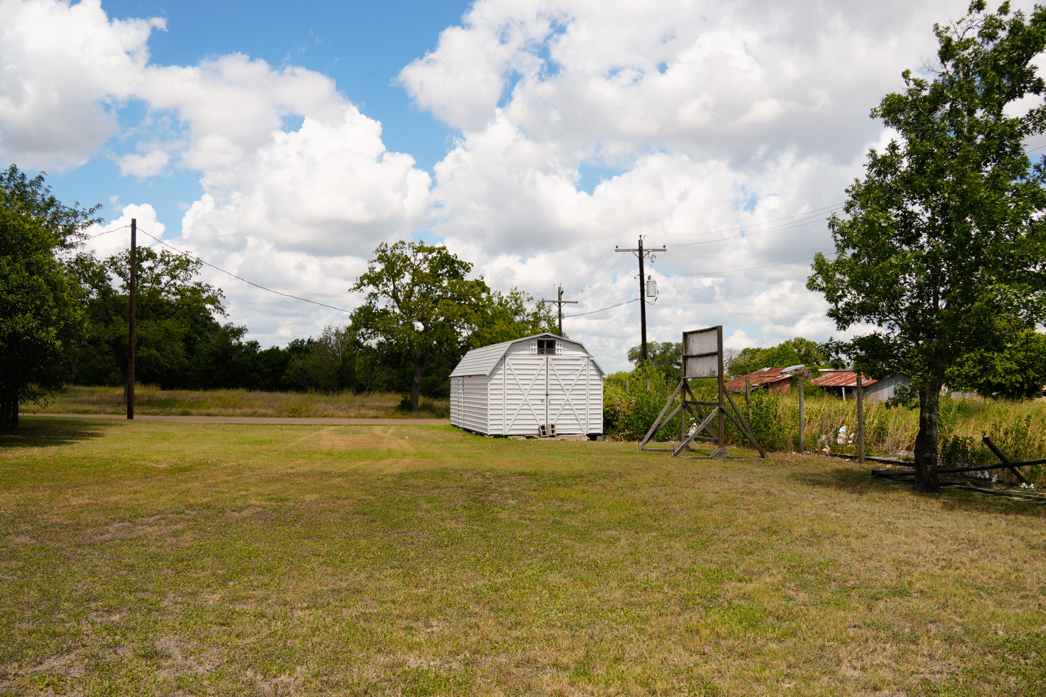 1400 Fm 609 Road Muldoon, TX 78949 - Photo 17 of 24 View of green lawn with a storage shed