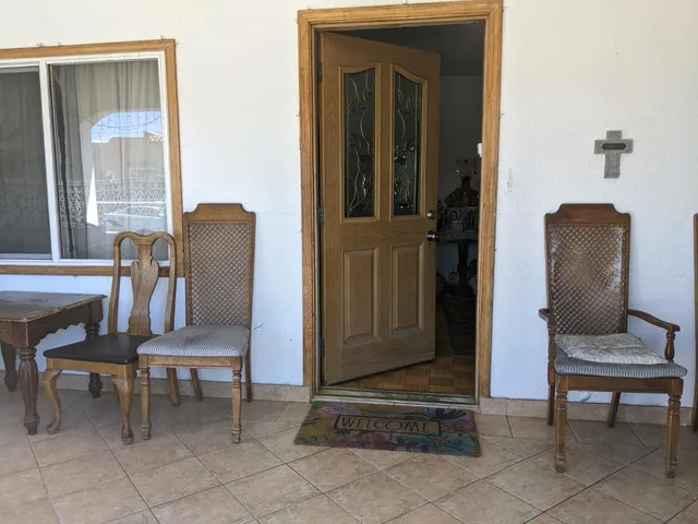 a view of living room with chair and piano